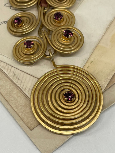 1970’s Matte Gold Spiral Brooch with Purple Rhinestones Devil's Details